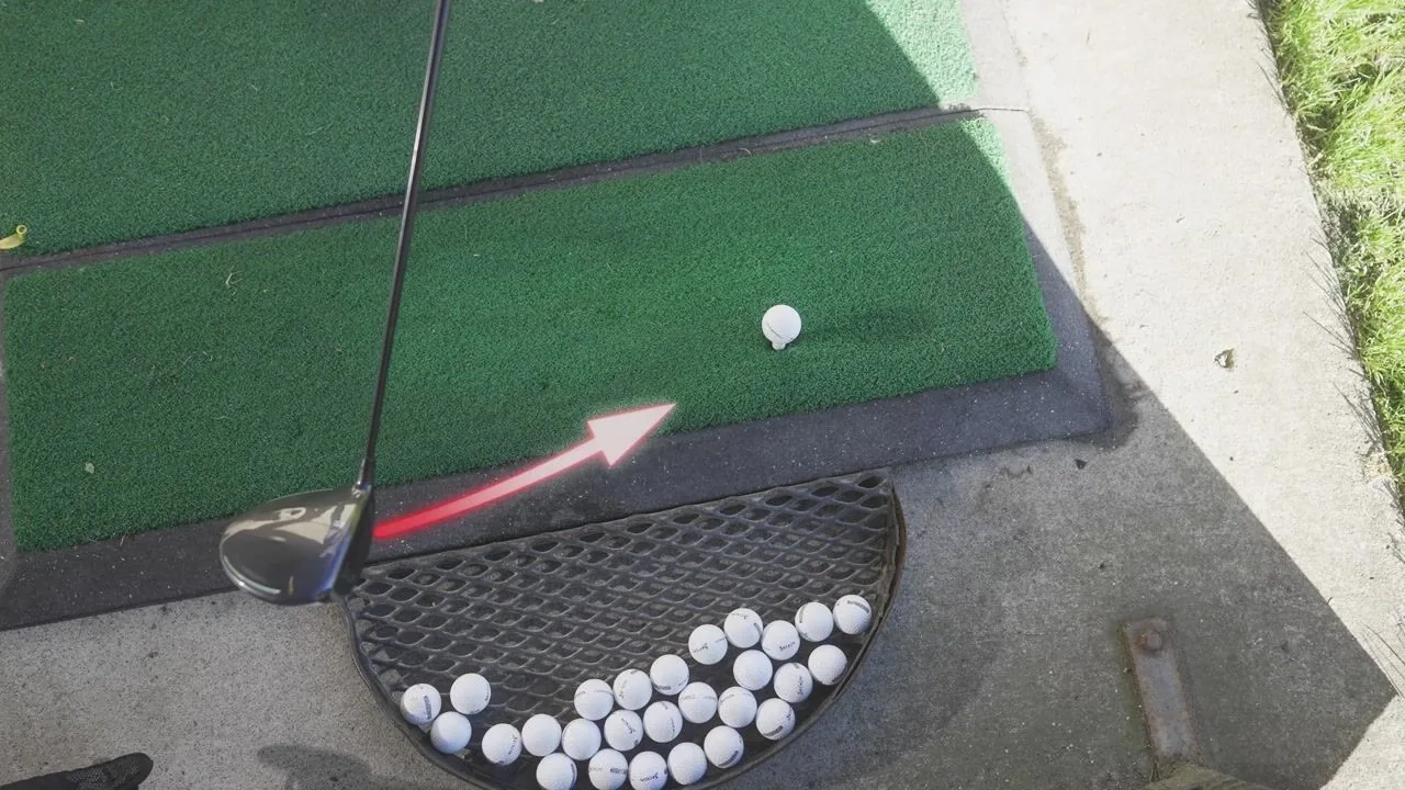 A golf club swings toward a ball on a green practice mat in a product demonstration