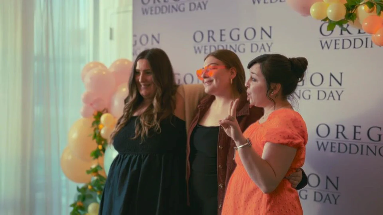 Three attendees pose together at an Oregon Wedding Day event